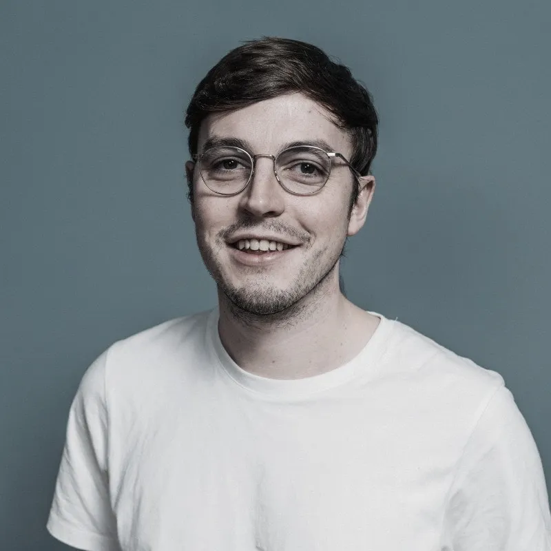The concierge who answers enquiries, in a studio portrait