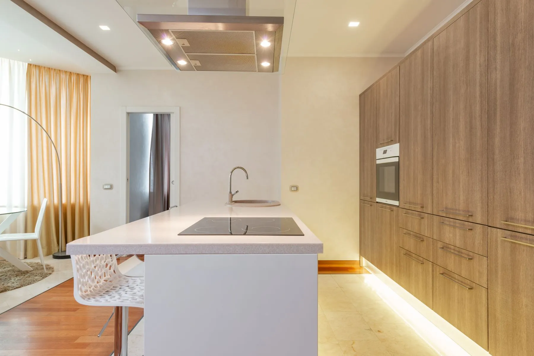 A calm kitchen with a wooden island